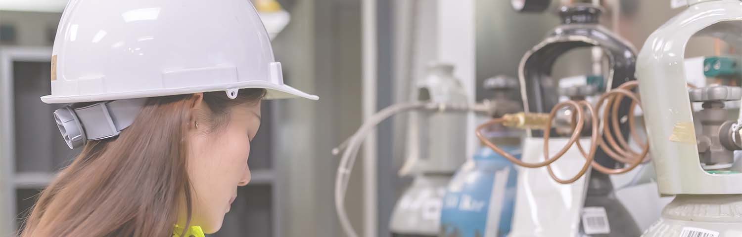 Woman near Hydrogen bottles